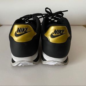 nike cortez ultra black gold
